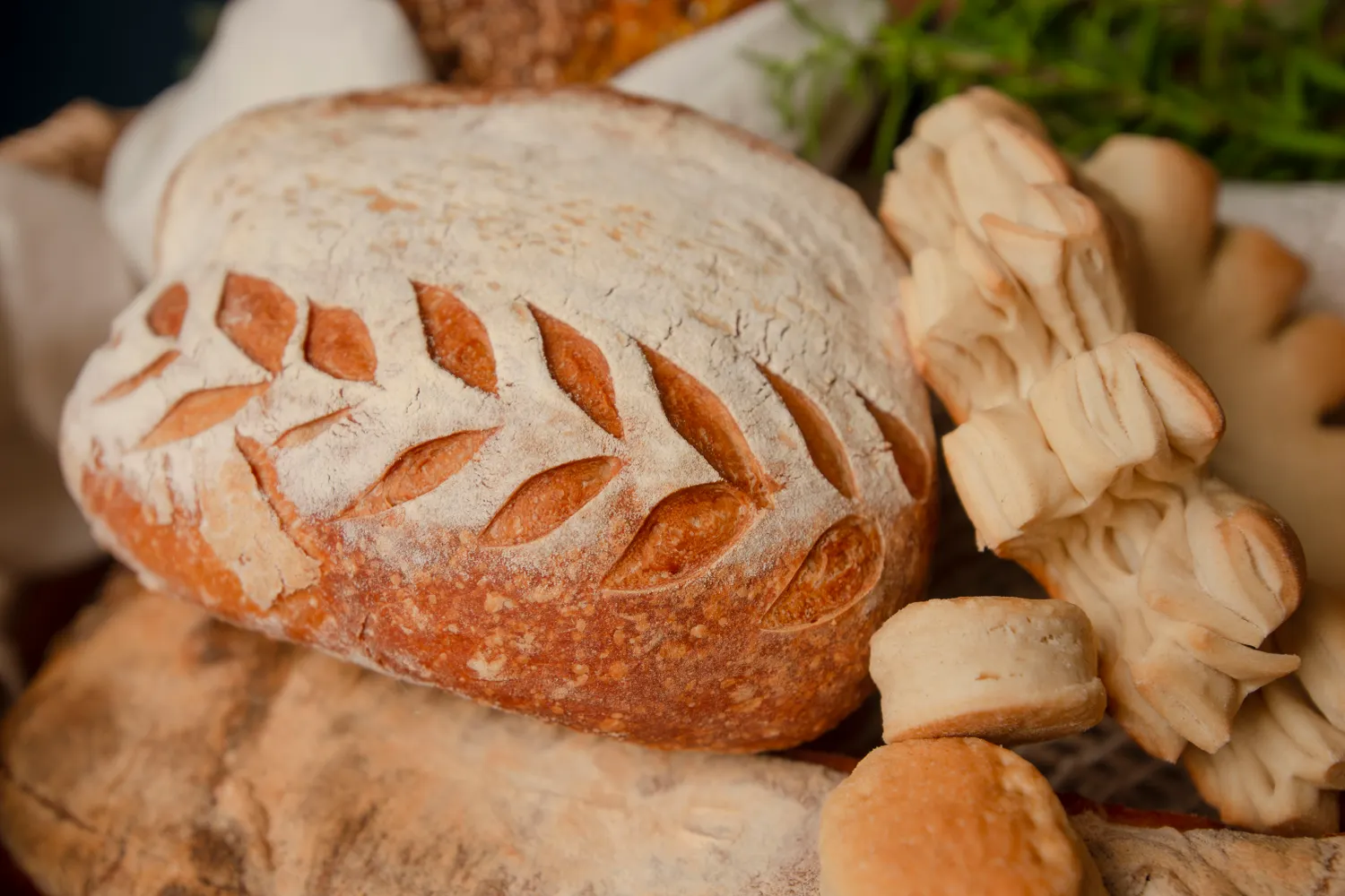 Decoratively scored artisan bread and baked goods